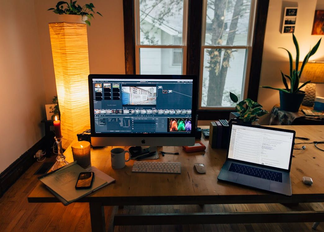 modern workspace with laptop and monitor